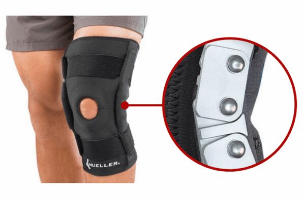 Orteza kolana z zawiasami i otworem na rzepkę Hinged Wraparound Knee Brace - Mueller